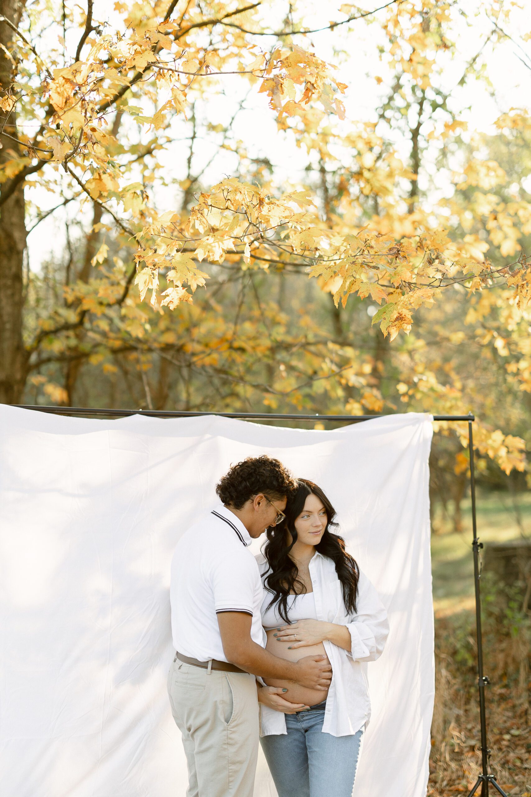 Fall maternity with white sheet